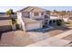 Two-story house with a two-car garage and solar panels at 6422 S 26Th Ln, Phoenix, AZ 85041