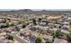 Aerial view showing a neighborhood with houses, pools, and desert landscaping at 6868 W Cottontail Ln, Peoria, AZ 85383