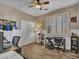 Functional home office with wood floors and built-in shelving at 6868 W Cottontail Ln, Peoria, AZ 85383