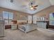 Bright and spacious main bedroom with comfortable furnishings at 6868 W Cottontail Ln, Peoria, AZ 85383