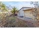 Backyard with a patio, lush trees, and desert landscaping at 743 E Horizon Heights Dr, San Tan Valley, AZ 85143