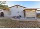 Backyard with a patio, a fire pit, and desert landscaping at 743 E Horizon Heights Dr, San Tan Valley, AZ 85143