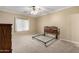 Cozy bedroom with soft carpet, ceiling fan, and a serene ambiance ready for relaxation at 743 E Horizon Heights Dr, San Tan Valley, AZ 85143