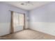 Cozy bedroom with carpet, neutral walls, and a window with blinds at 743 E Horizon Heights Dr, San Tan Valley, AZ 85143