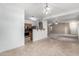 Open dining room boasts tile flooring, modern light fixture, and flows into the kitchen and living areas at 743 E Horizon Heights Dr, San Tan Valley, AZ 85143