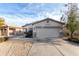 Well-maintained home with a two-car garage, xeriscaping, and a clear view of the street at 743 E Horizon Heights Dr, San Tan Valley, AZ 85143