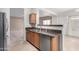 Kitchen with stainless steel appliances, granite countertops, and an open view into the living area at 743 E Horizon Heights Dr, San Tan Valley, AZ 85143