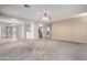 Open living area with neutral walls, a ceiling fan, and views into the kitchen and dining areas at 743 E Horizon Heights Dr, San Tan Valley, AZ 85143