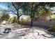 Landscaped backyard with flagstone patio and mature trees at 8227 E Sierra Pinta Dr, Scottsdale, AZ 85255