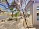 Landscaped backyard with a pathway, water feature, and mature trees at 8227 E Sierra Pinta Dr, Scottsdale, AZ 85255