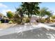 Single-story home with landscaped front yard and attached garage at 8227 E Sierra Pinta Dr, Scottsdale, AZ 85255