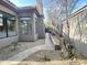 Home's exterior with a stone pathway alongside mature trees at 8227 E Sierra Pinta Dr, Scottsdale, AZ 85255