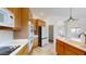 Kitchen with wood cabinets, white countertops, and tile backsplash at 8227 E Sierra Pinta Dr, Scottsdale, AZ 85255