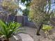 Stone pathway meanders through a garden with gravel and greenery at 8227 E Sierra Pinta Dr, Scottsdale, AZ 85255