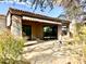 Covered patio with flagstone flooring and access to the backyard at 8227 E Sierra Pinta Dr, Scottsdale, AZ 85255