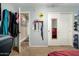 Bedroom with sliding doors and mirrored closet doors at 8642 W Harmony Ln, Peoria, AZ 85382