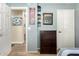 Bedroom with a dresser, mirror, and access to hallway at 8642 W Harmony Ln, Peoria, AZ 85382