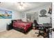 Bedroom with a queen bed, desk and ceiling fan at 8642 W Harmony Ln, Peoria, AZ 85382