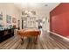 Spacious game room with pool table, hardwood floors, and an open floor plan at 8642 W Harmony Ln, Peoria, AZ 85382