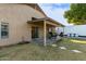 Covered patio with seating area and grill at 8642 W Harmony Ln, Peoria, AZ 85382