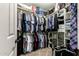 Large walk-in closet with shelving and rod at 8642 W Harmony Ln, Peoria, AZ 85382
