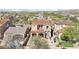 An elevated perspective of the property showcases a pool and neighboring residences with unique designs at 9305 E Canyon View Rd, Scottsdale, AZ 85255