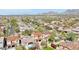 High-angle view of a vibrant neighborhood with diverse houses, verdant greenery, and sparkling pools at 9305 E Canyon View Rd, Scottsdale, AZ 85255