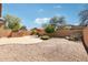 Landscaped backyard with a built-in grill station and gravel area, perfect for entertaining at 9305 E Canyon View Rd, Scottsdale, AZ 85255