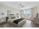 Neutral bedroom with large windows, ceiling fan, and soft textures, offering a serene retreat at 9305 E Canyon View Rd, Scottsdale, AZ 85255