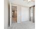 This bedroom has a neutral carpet, ceiling fan and sliding closet doors at 9305 E Canyon View Rd, Scottsdale, AZ 85255