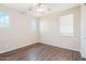 Bright bedroom with modern flooring, neutral walls, a ceiling fan, and ample natural light from two windows at 9305 E Canyon View Rd, Scottsdale, AZ 85255