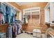 This walk in closet has wood paneling and built in organizers at 9305 E Canyon View Rd, Scottsdale, AZ 85255