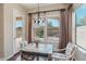Charming dining area with a decorative table, stylish chairs, and bright natural light overlooking the backyard at 9305 E Canyon View Rd, Scottsdale, AZ 85255