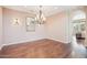 Elegant dining room featuring hardwood floors, chandelier, and a large mirror at 9305 E Canyon View Rd, Scottsdale, AZ 85255