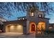 Charming home featuring a two-car garage and an inviting front porch with seating at 9305 E Canyon View Rd, Scottsdale, AZ 85255