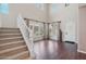 Elegant foyer featuring hardwood floors, staircase, and abundant natural light at 9305 E Canyon View Rd, Scottsdale, AZ 85255
