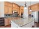 Spacious kitchen featuring stainless steel appliances, granite countertops, and ample cabinet space for storage at 9305 E Canyon View Rd, Scottsdale, AZ 85255