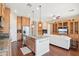Open kitchen with a large center island, stainless steel appliances, and seamless flow into the adjacent living space at 9305 E Canyon View Rd, Scottsdale, AZ 85255