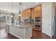 Well-equipped kitchen featuring stainless steel appliances, a center island with granite countertops, and abundant cabinet space at 9305 E Canyon View Rd, Scottsdale, AZ 85255
