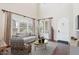 Bright living room with large windows, high ceilings, modern decor, and elegant furnishings at 9305 E Canyon View Rd, Scottsdale, AZ 85255