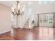 Bright living room featuring hardwood floors, staircase, and a chandelier at 9305 E Canyon View Rd, Scottsdale, AZ 85255