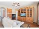 Cozy living room with a fireplace, built-in shelving, and comfortable seating perfect for relaxation and entertainment at 9305 E Canyon View Rd, Scottsdale, AZ 85255