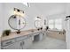 Elegant bathroom with double vanity and marble flooring at 9544 W Sierra Pinta Dr, Peoria, AZ 85382