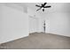 Large bedroom with plush carpeting and access to another room at 9544 W Sierra Pinta Dr, Peoria, AZ 85382