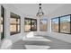 Bright dining area with large windows and chandelier at 9544 W Sierra Pinta Dr, Peoria, AZ 85382