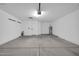 Garage with concrete floor and extra storage at 9544 W Sierra Pinta Dr, Peoria, AZ 85382