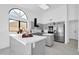 Modern kitchen with gray cabinets and stainless steel appliances at 9544 W Sierra Pinta Dr, Peoria, AZ 85382