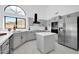 Modern kitchen with gray cabinets and a large island at 9544 W Sierra Pinta Dr, Peoria, AZ 85382
