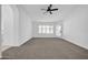 Spacious living room featuring large windows and neutral decor at 9544 W Sierra Pinta Dr, Peoria, AZ 85382
