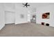 Bright living room with high ceilings and neutral carpeting at 9544 W Sierra Pinta Dr, Peoria, AZ 85382